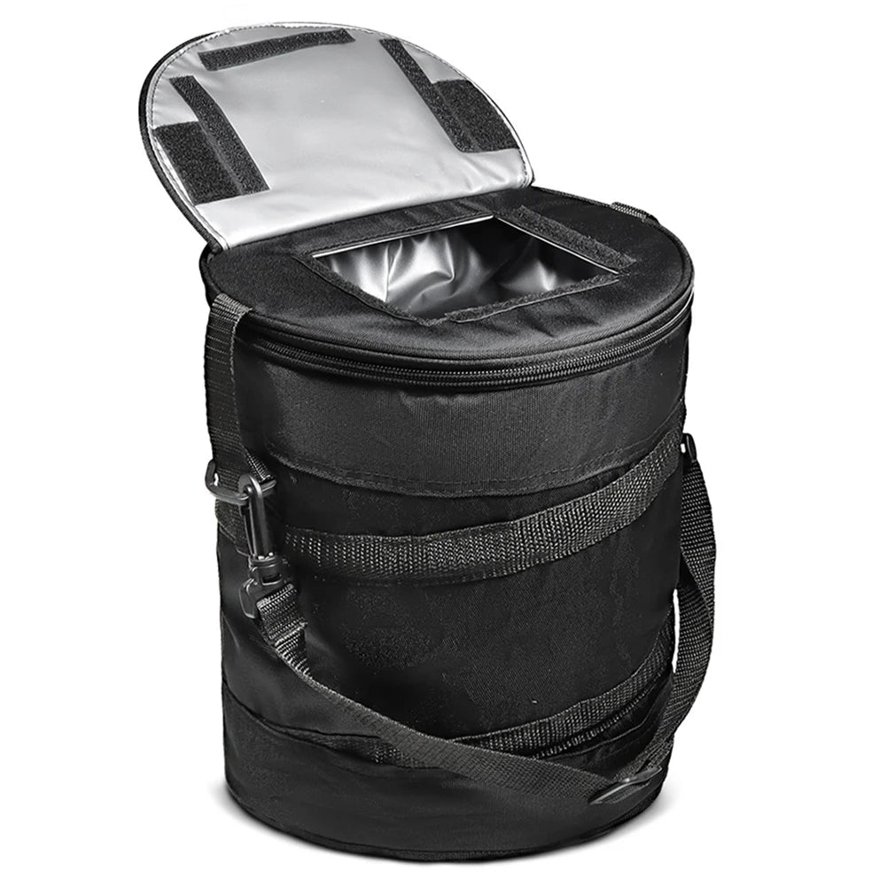 Black cooler bag open to show its silver-colored insulated lining