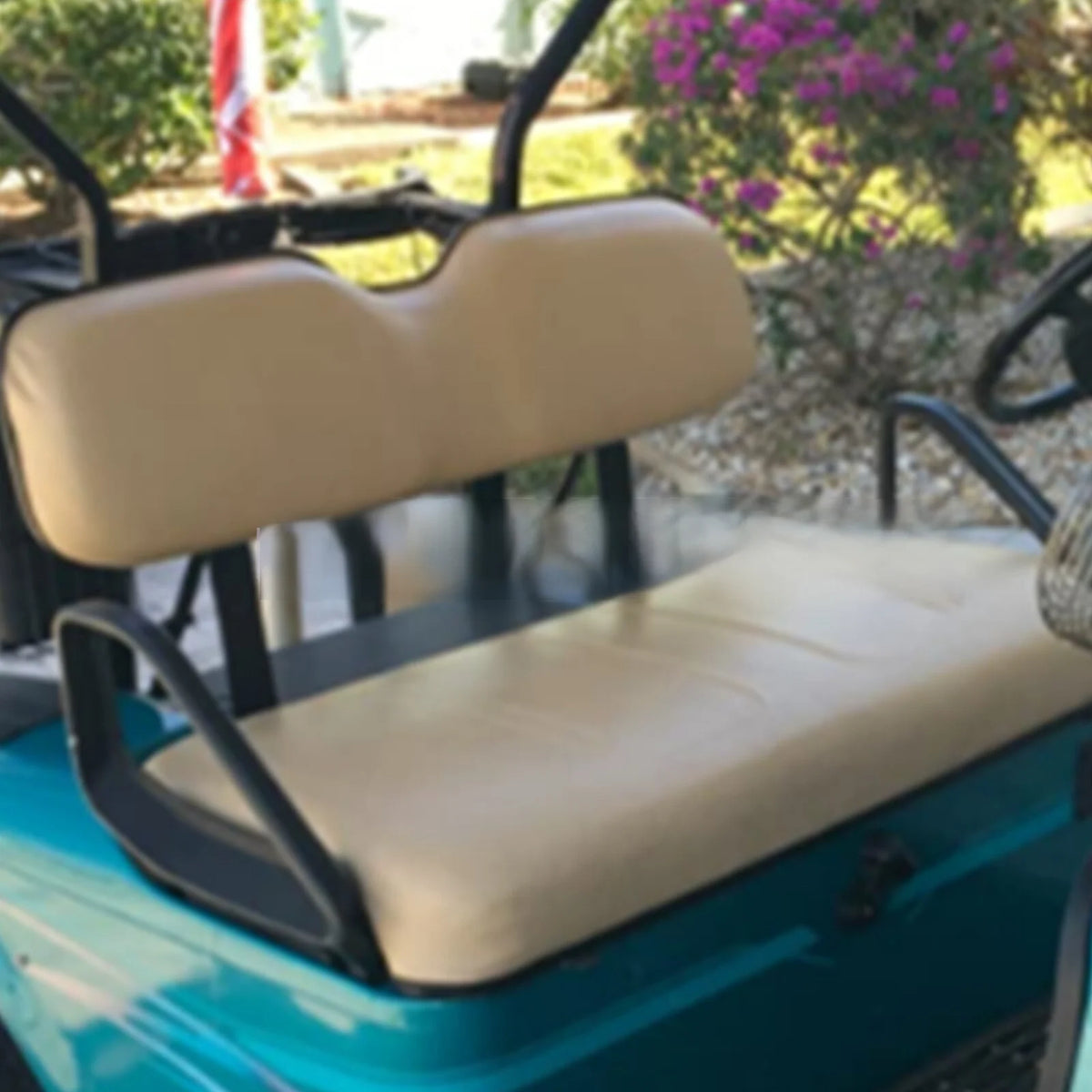 Tan bench and broad one-piece backrest upholstery shown installed on a golf cart - Fairway Fort™