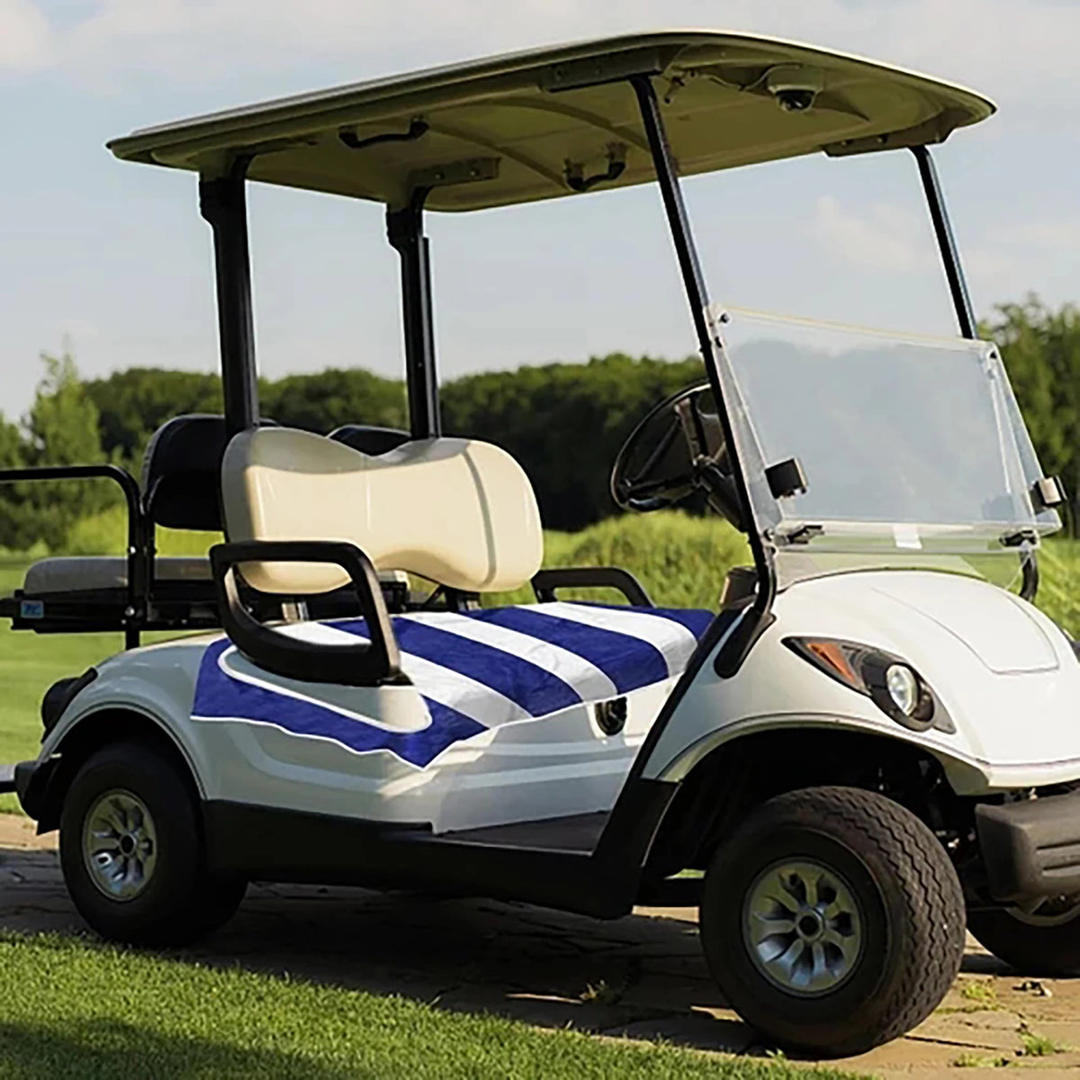 Blue and white seat towel shown on a parked golf cart bench - Fairway Fort™