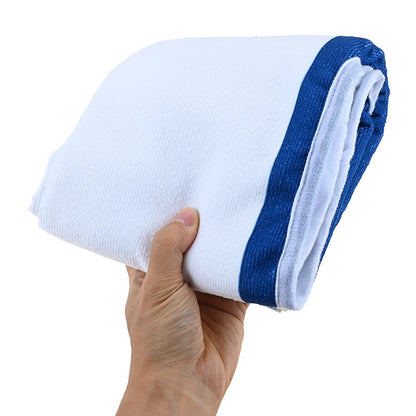 Folded blue and white seat towel held in one hand